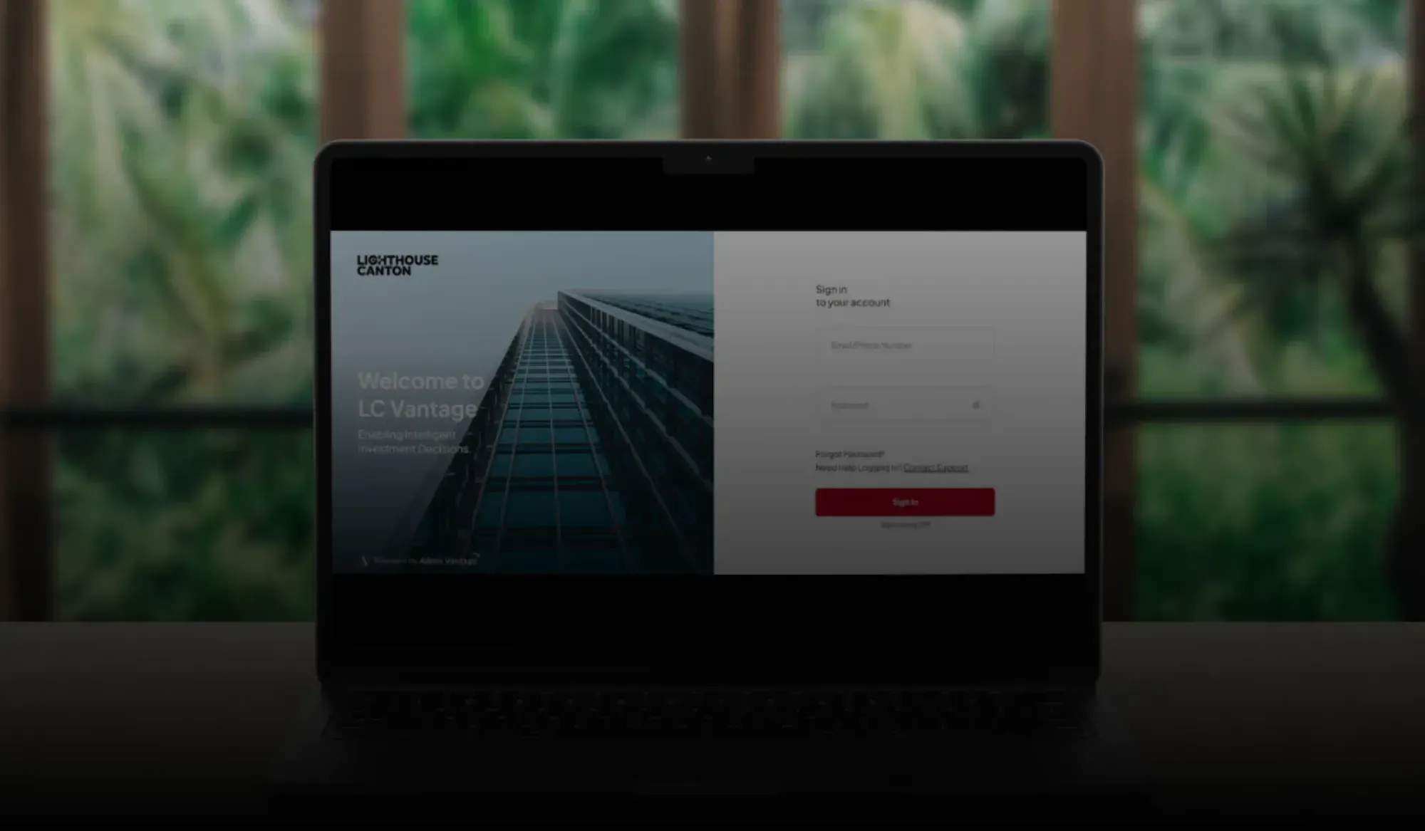 Laptop screen showing Lighthouse Canton LC Vantage login page with building image and sign-in form.